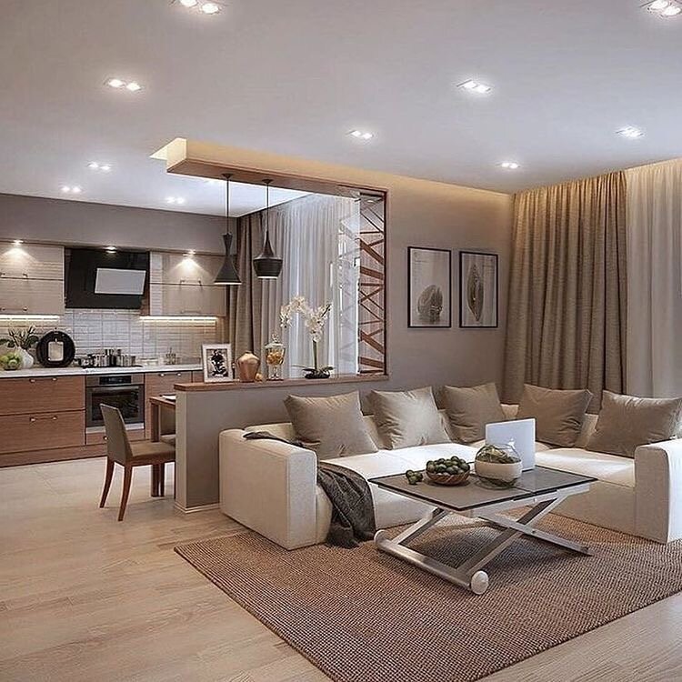 Большая квартира студия, где гостиная совмещена с кухней и столовой