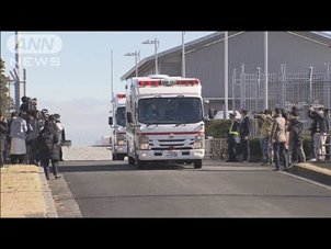 Доставка прибывших чартерным рейсом из китайского города Ухань, кадр из репортажа ANN от 29 января 2020 года