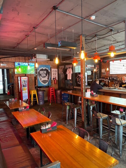 Первый этаж, справа барная стойка.