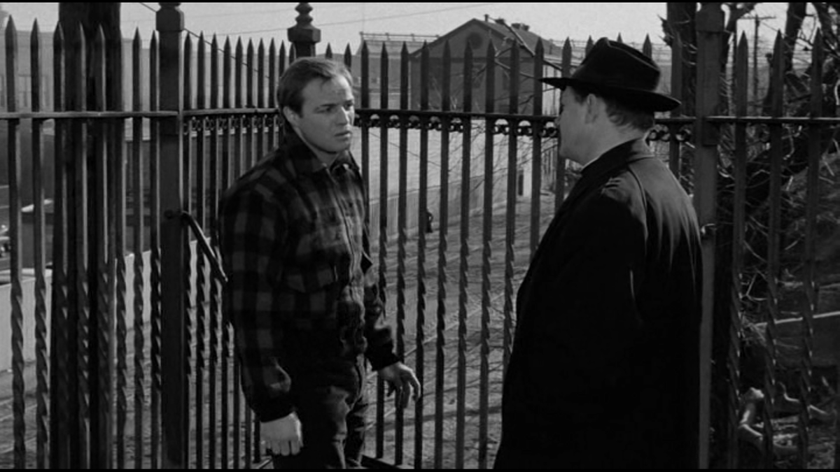 Священник взывает к совести Терри и толкает его на признание о своём участии в гибели Джои Дойла