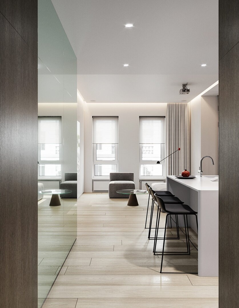 Часто до ремонта квартира кажется больше и просторнее. Дизайнеры решили сохранить это ощущение светлого открытого пространства, отказавшись от стен в классическом смысле. Вместо них в квартире появились стеклянные перегородки, пропускающие дневной свет и сохраняющие целостность пространства.