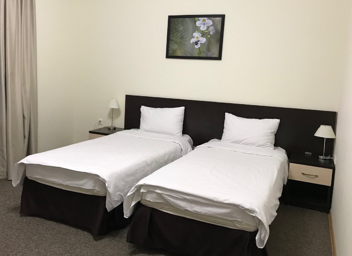 Спальня 2-комнатного люкса в Gamma Sirius Park.