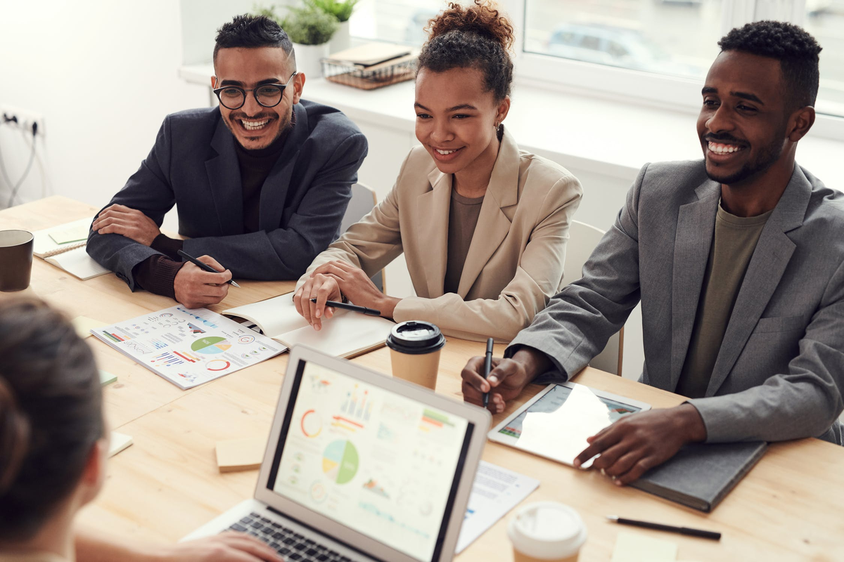 pexels.com/photo/photo-of-three-people-smiling-while-having-a-meeting-3184338/