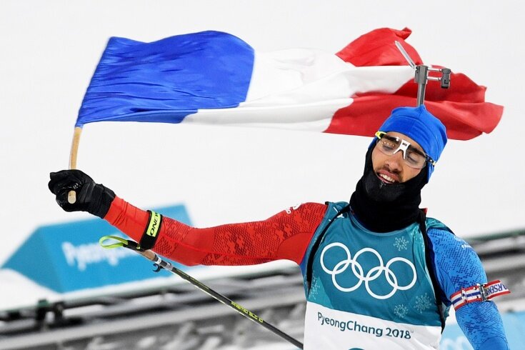 Мартен Фуркад финиширует с флагом Франции на Олимпиаде-2018. Фото: РИА Новости