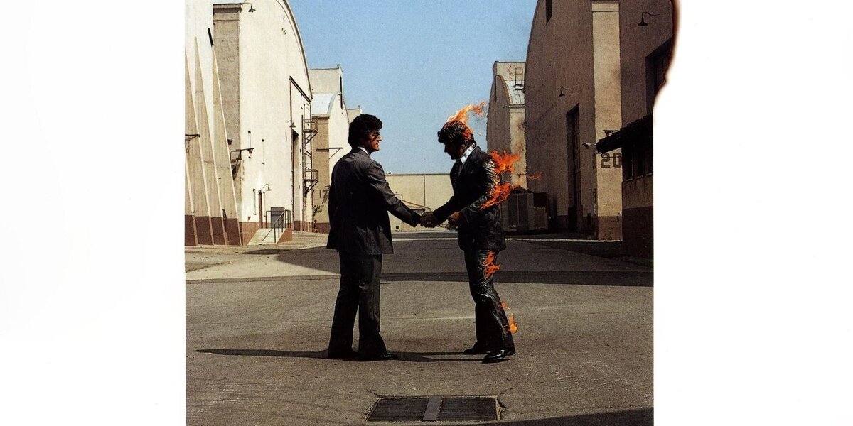 обложка альбома группы Pink Floyd "Wish You Were here"