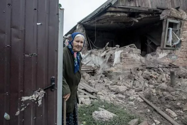 © РИА Новости / Андрей Стенин Разрушения после артобстрела поселка Голубовка под Славянском, 27 июня 2014. Андрей Стенин / РИА Новости