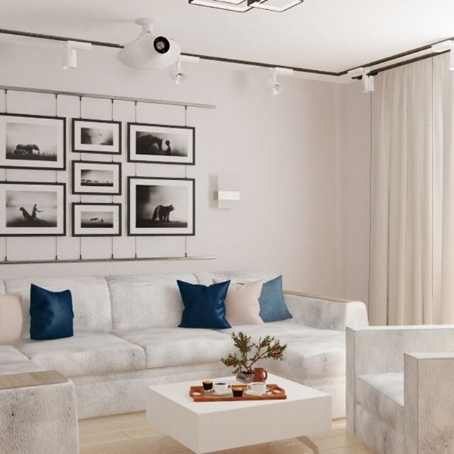 Вид на диванную зону с картинным декором на стене                                                          
Источник:  instagram.com/medealight.diz/  Дизайнер: Плёнкина Ольга