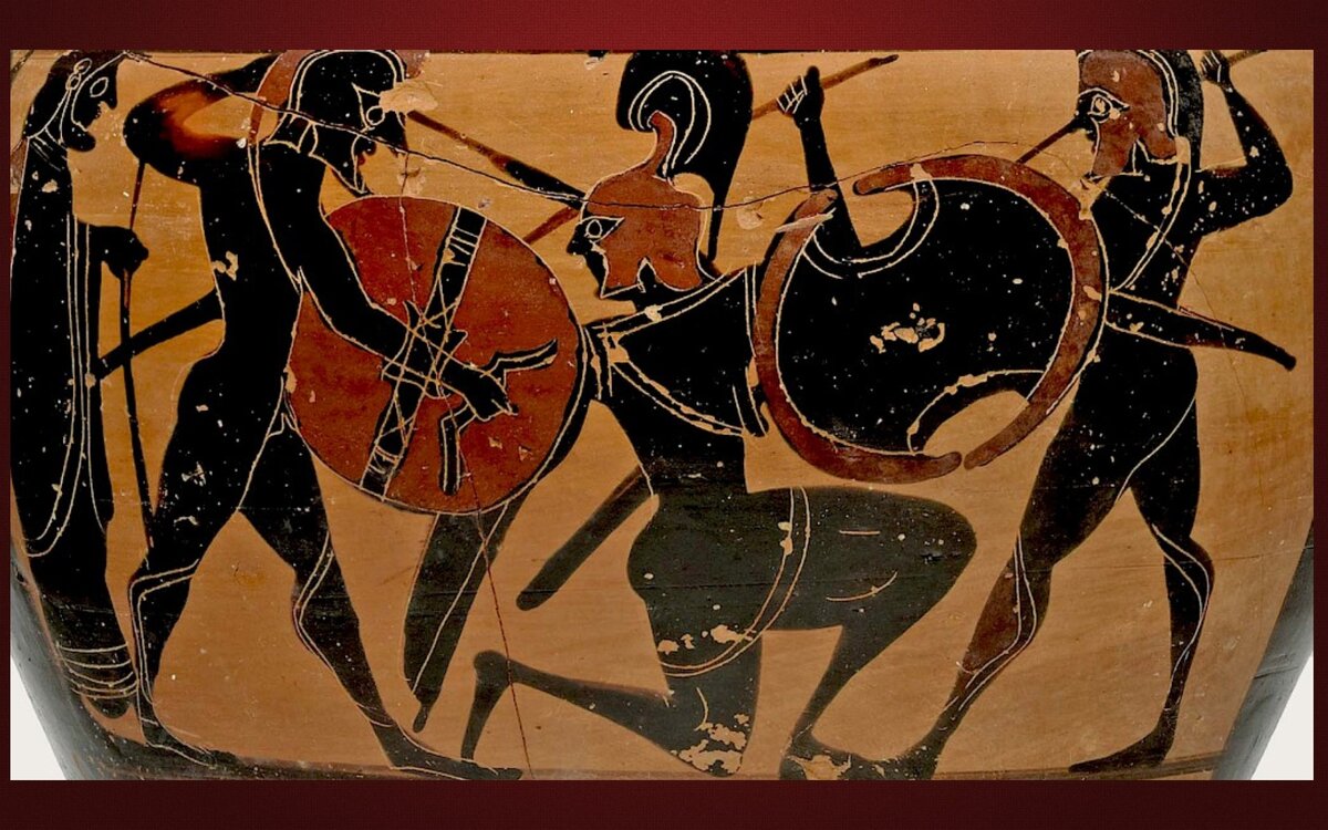 Слева у воина гоплон, а справа щит беотийского типа. 