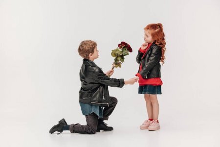 https://st3.depositphotos.com/12071432/17957/i/1600/depositphotos_179571720-stock-photo-boy-presenting-roses-bouquet-his.jpg