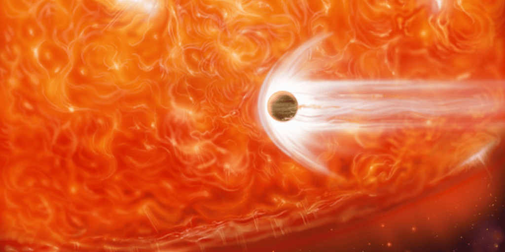    Планета, начинающая погружаться в атмосферу красного гиганта, в представлении художника. / © Penn State