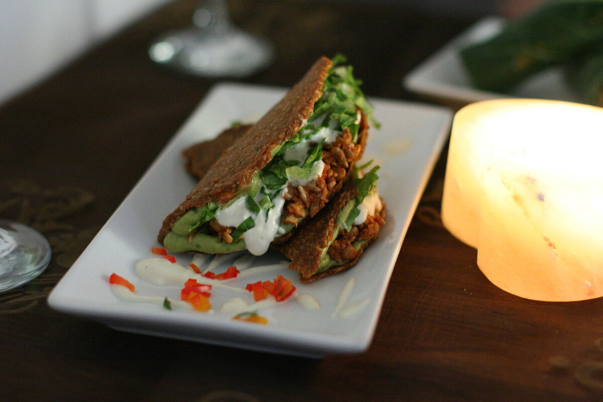 By Geoff Peters from Vancouver, BC, Canada - Raw Food Tacos, CC BY 2.0, https://commons.wikimedia.org/w/index.php?curid=34985950 
Raw food tacos prepared with guacamole, non-fried beans and sour cream. Raw foodism promotes the consumption of food which has not been cooked.
Geoff Peters from Vancouver, BC, Canada - Raw Food Tacos
Raw food tacos prepared with guacamole, non-fried beans and sour cream.

CC BY 2.0
File:Raw food tacos.jpg
Created: 20 April 2009

https://en.wikipedia.org/wiki/Diet_(nutrition)#/media/File:Raw_food_tacos.jpg