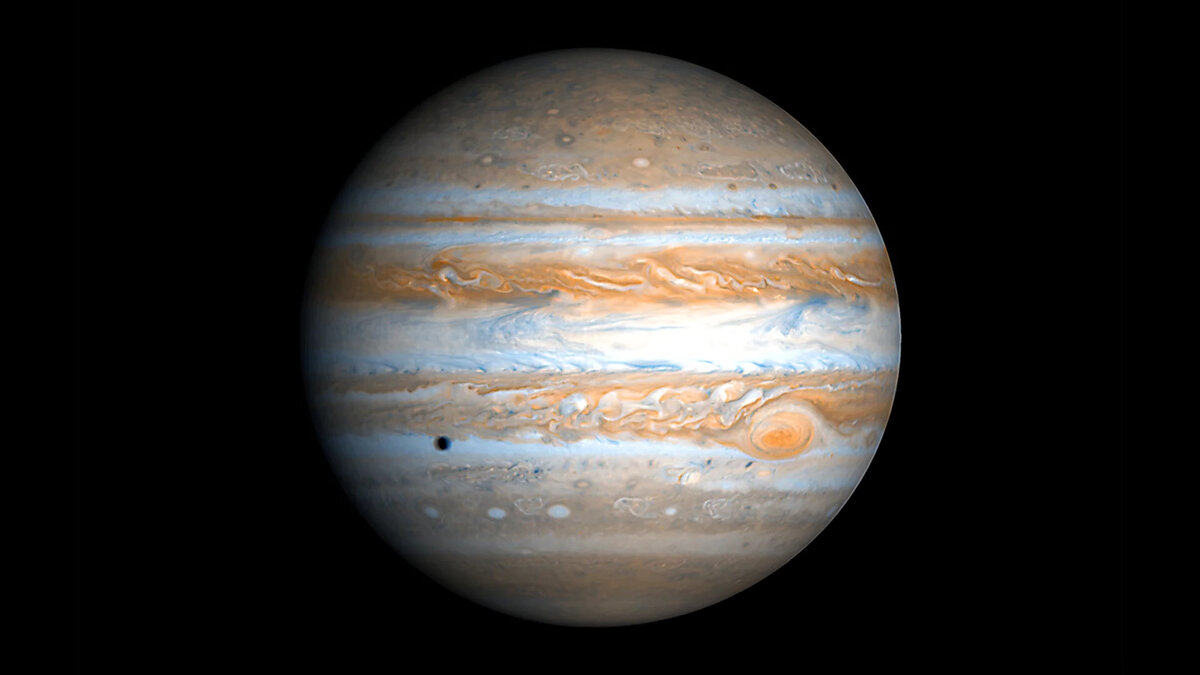 Реальная фотография Юпитера, сделанная автоматической межпланетной станцией "Кассини". Источник: Яндекс-картинки