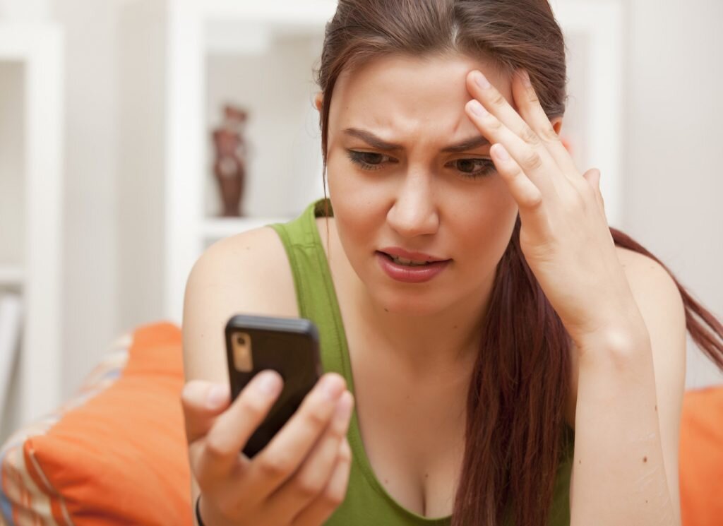    shocked and frustrated woman with cellphone; Shutterstock ID 79595149; PO: The Huffington Post; Job: The Huffington Post; Client: The Huffington Post; Other: The Huffington Post admin