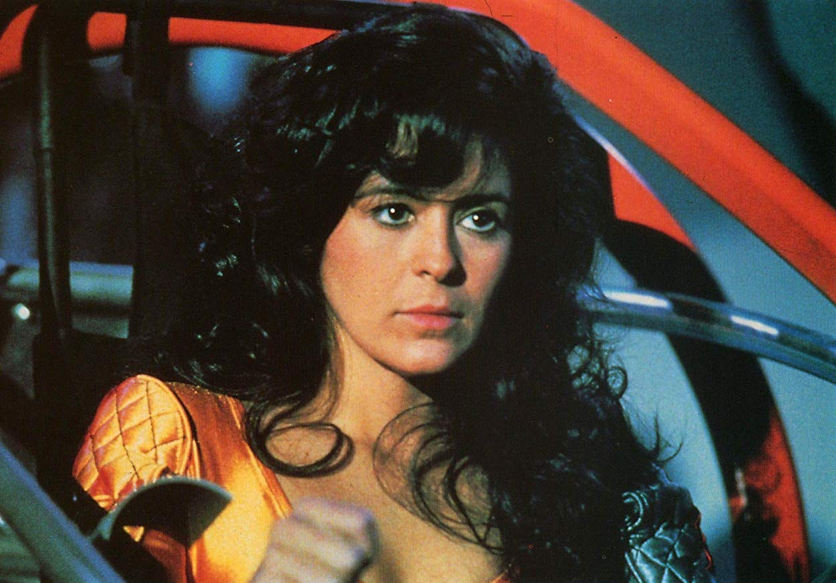 Мария Кончита Алонсо в фильме «Бегущий человек». Кадр из фильма