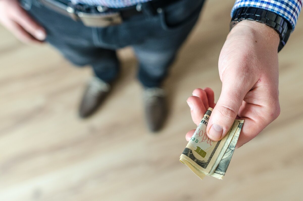 https://www.pexels.com/photo/person-holding-banknote-928184/