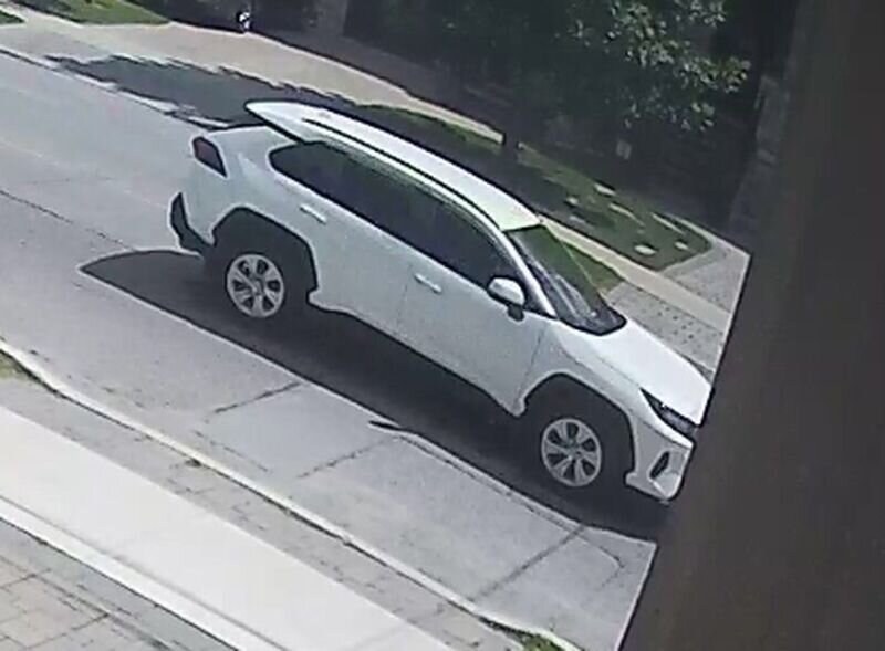 Photo from Police Press Release. Security camera image of suspect vehicle, White, 2019 RAV4