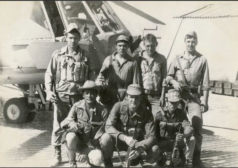 Раимжан в первом ряду слева.