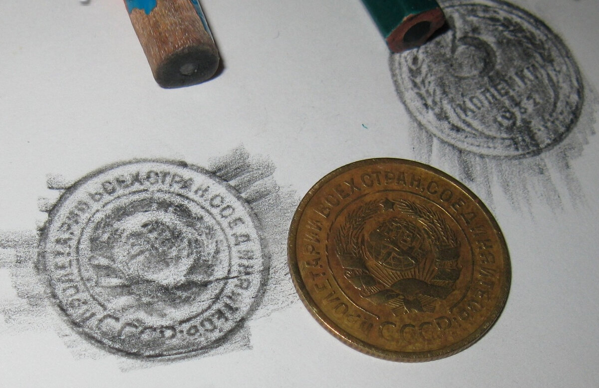 Отпечаток монет на бумаге