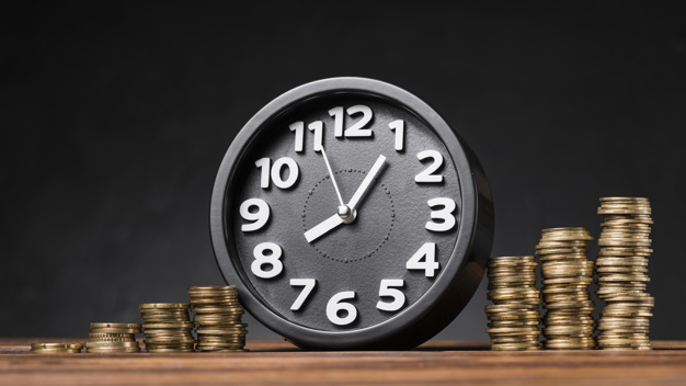 https://image.freepik.com/free-photo/round-clock-increasing-coins-wooden-desk-against-black-backdrop_23-2147943617.jpg