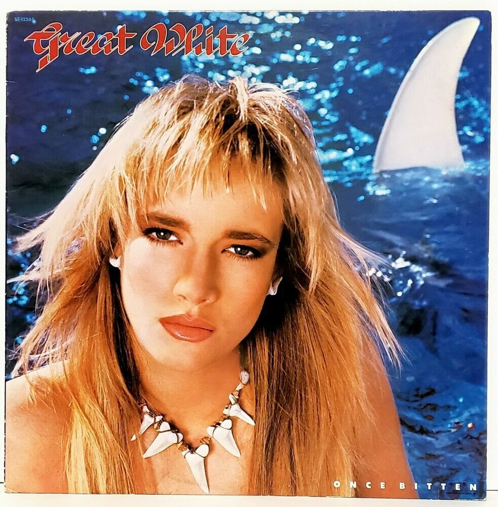 На обложке LP "Once Bitten" девушка, однажды укушенная акулой, с бусами из трофейных зубов.  