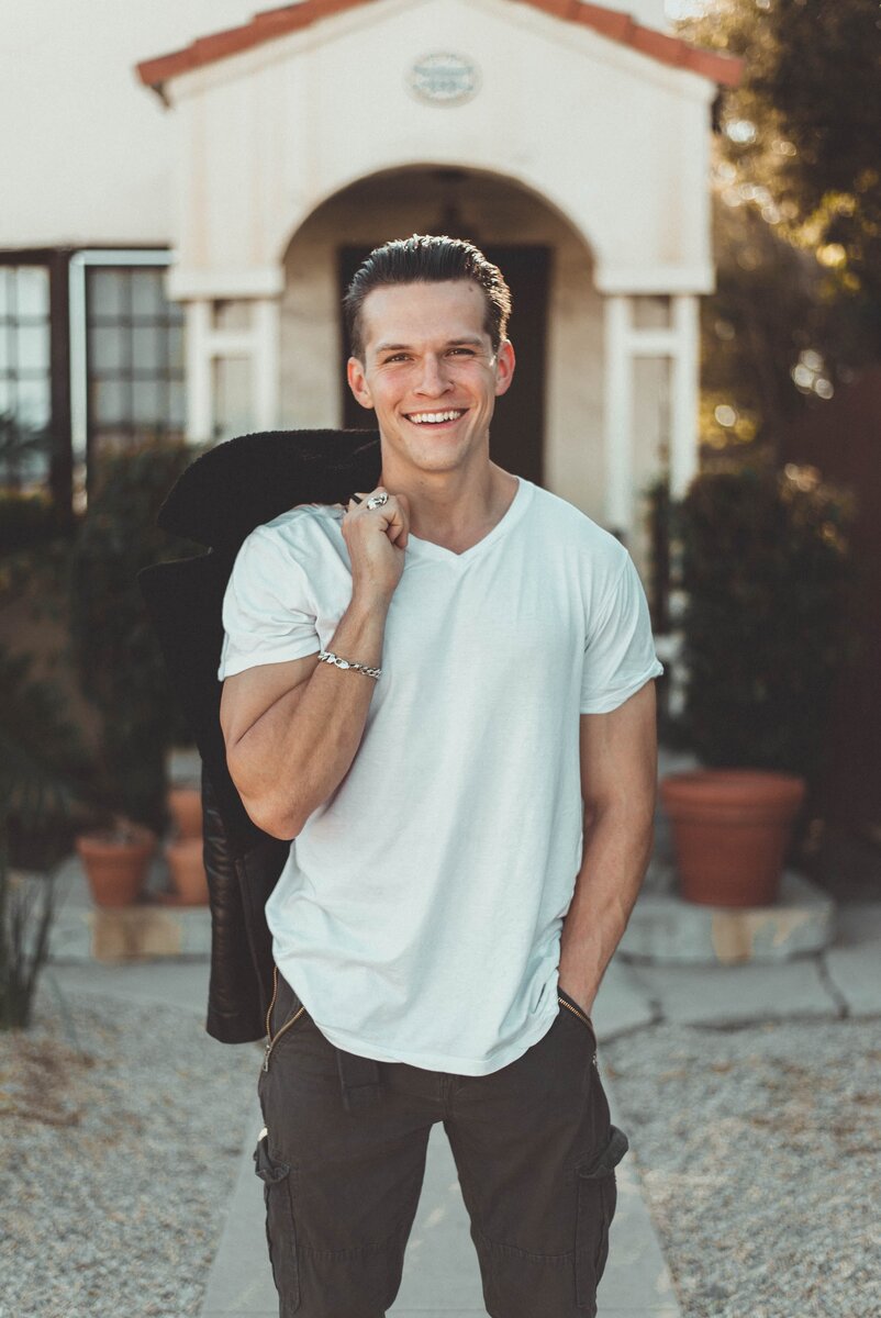 https://www.pexels.com/photo/man-in-white-v-neck-t-shirt-and-black-pants-775358/