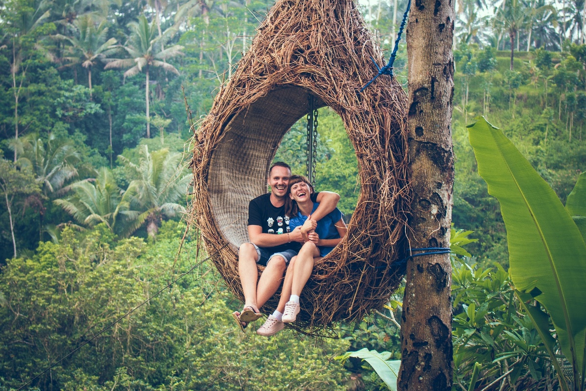 https://www.pexels.com/photo/man-and-woman-sitting-on-hanging-chair-by-a-tree-1319829/