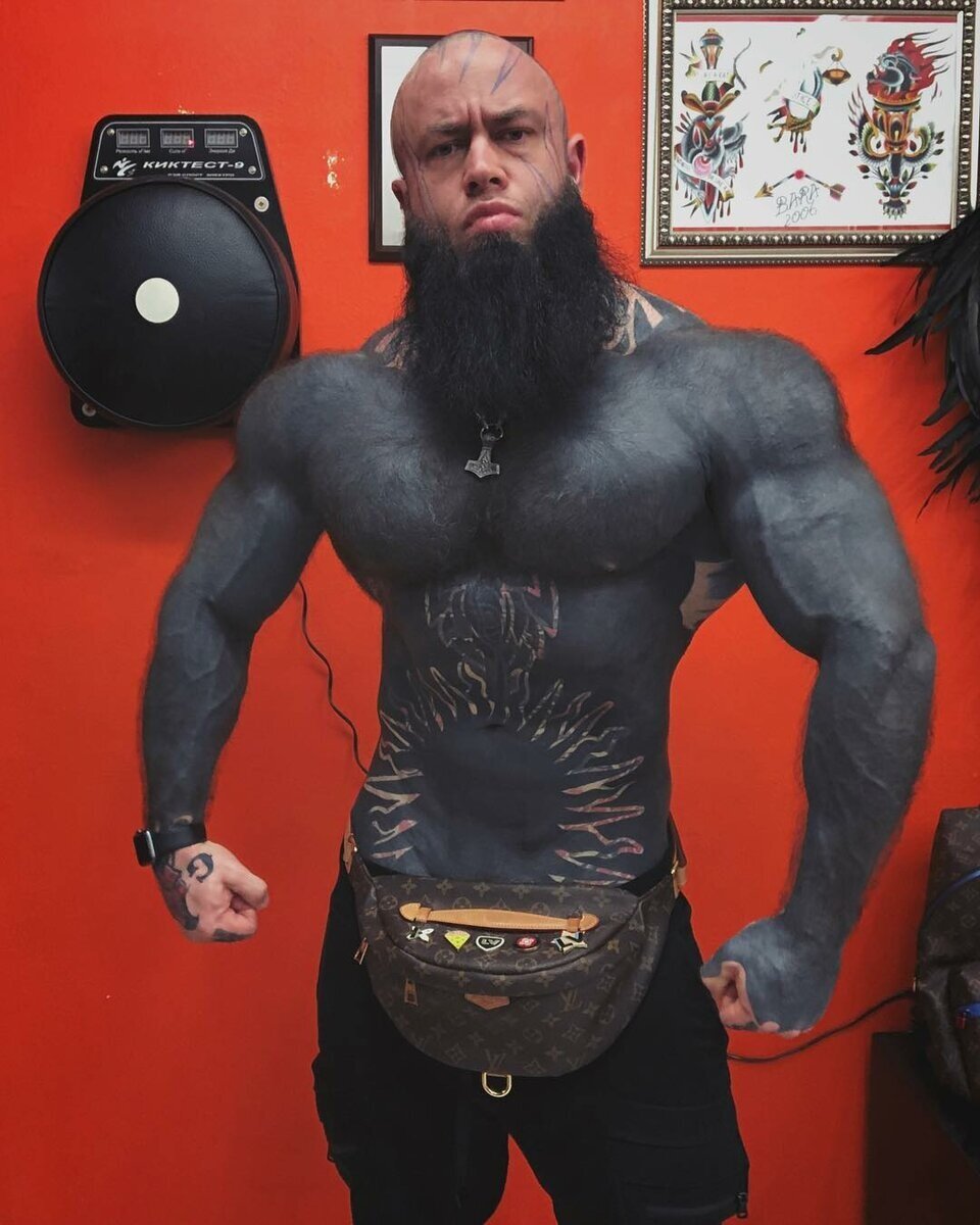 Bodybuilder tattoos entire body black