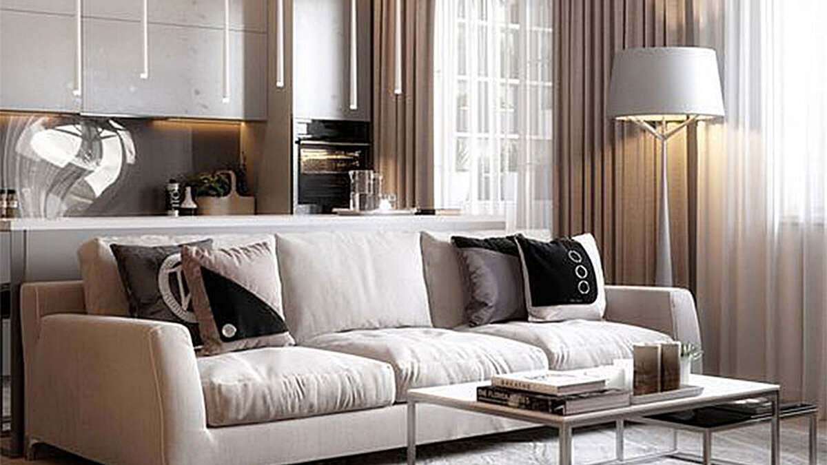 Кухонный гарнитур и диван в интерьере небольшой современной кухни гостиной.