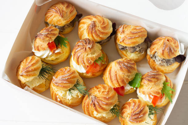 Профитроли с семгой и шпротами.