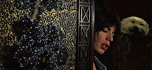 Мик в фильме "Представление" Доналда Кэммелла и Николаса Роуга, 1970.