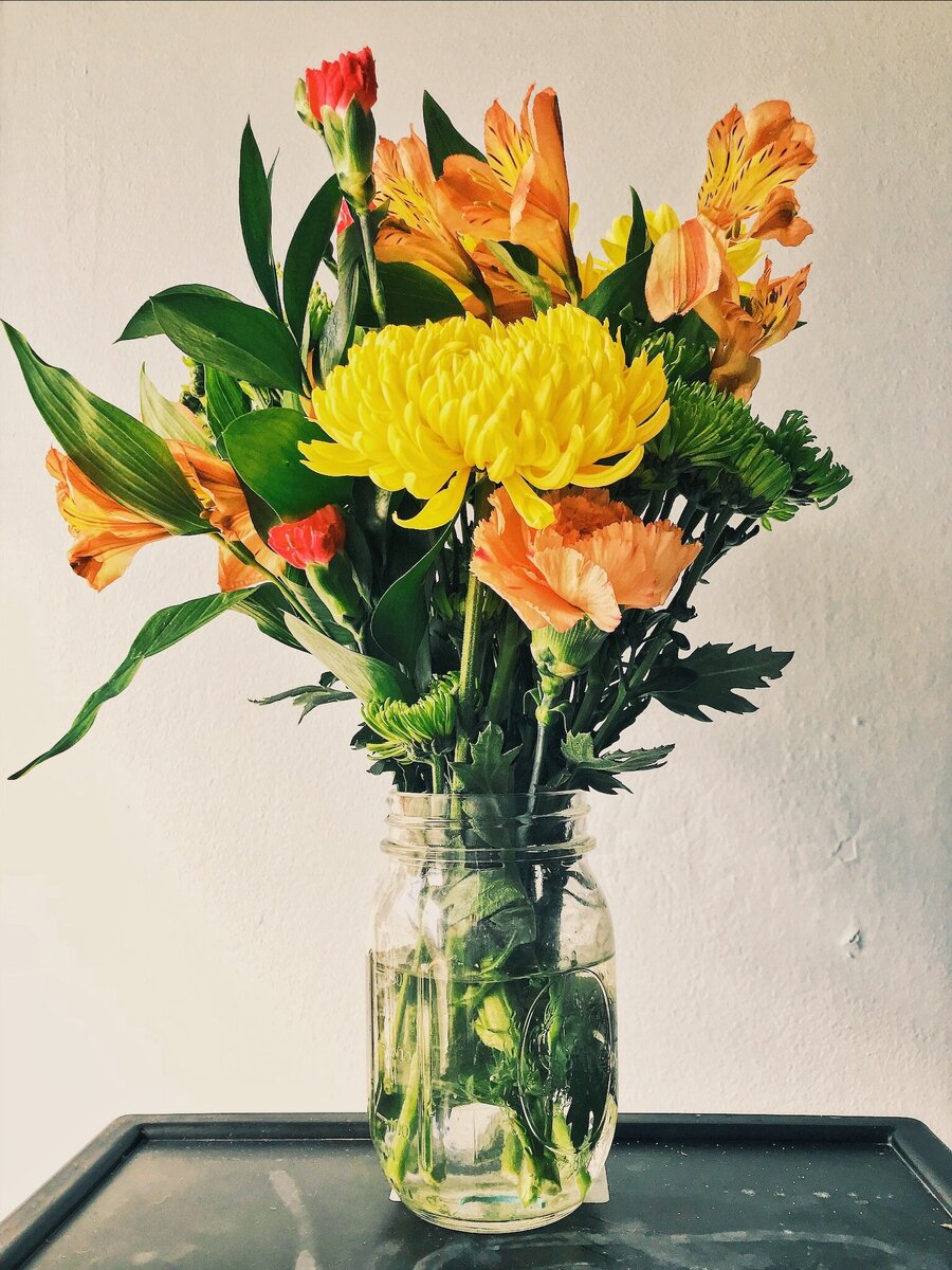 https://www.pexels.com/photo/yellow-mums-orange-peruvian-lilies-and-carnation-flower-arrangement-1058771/