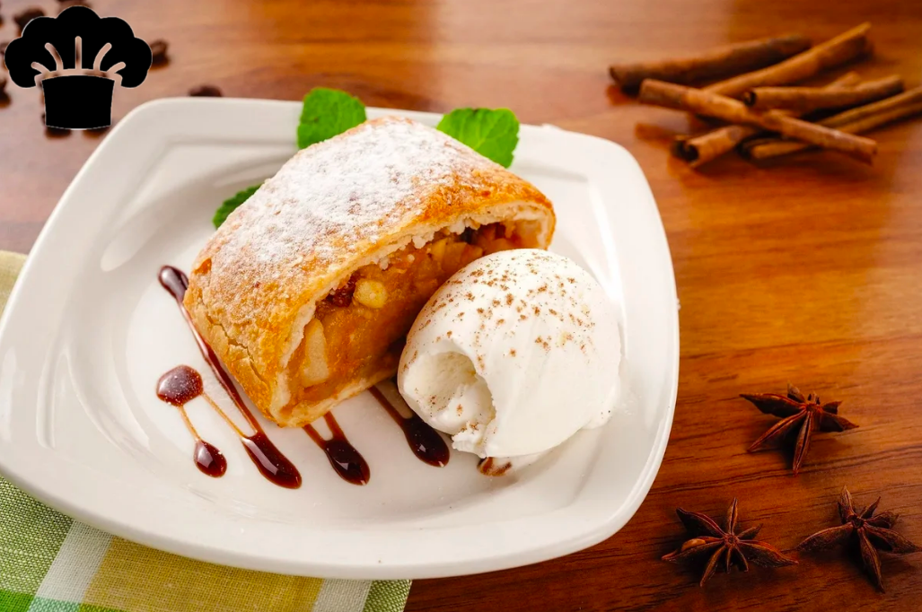 Время приготовления - 2 ч . 30 мин.
Мука пшеничная – 140 г 
Вода – 80 мл
Масло подсолнечное – 30 мл
Соль – 1/4 ч. л.
Масло сливочное – 90 г (для смазывания)
Изюм – 50 г
Ром – 30 мл
Масло сливочное – 30 г (для начинки)
Крошка хлебная – 60 г
Орехи грецкие – 60 г
Яблоки – 1 кг
Сахар – 100 г
Корица – 1.5 ч. л.
Сахарная пудра – 3 ст. л. (для посыпки штруделя после выпечки)