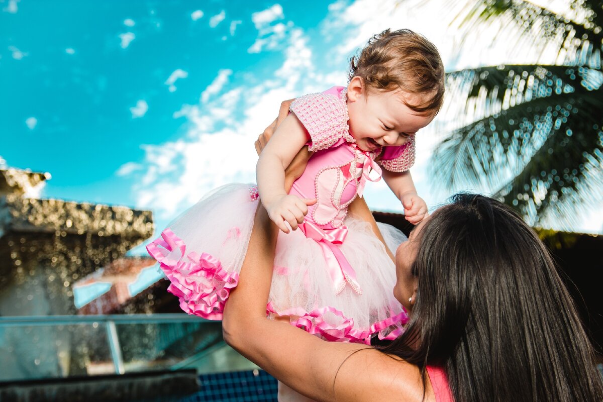 https://www.pexels.com/photo/woman-holding-baby-above-head-1131877/