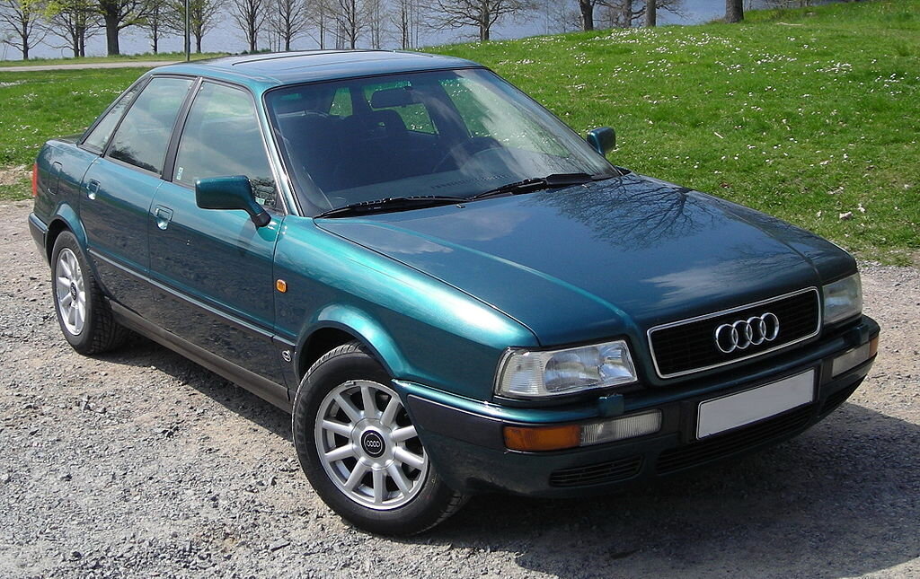 Семейство Audi F103 выпускалось в 1965—1972 годах и базировалось на модели DKW F102. Главное отличие — использование четырёхтактных двигателей вместо устаревших двухтактных. Включало в себя несколько моделей, обозначавшихся по мощности двигателя, выраженной в лошадинных силах, — Audi 60, Audi 72, Audi 75, Audi 80 и Audi 90. Эта модель дебютировала в Европе в 1973 году как Audi 80 и, в этом же году, в США как Audi Fox. Официальное представление автомобиля происходило на Женевском автосалоне в марте 1973 года. В этом же году автомобиль был назван "Европейским автомобилем года". Автомобиль был доступен в 2-х или 4-х дверном кузове типа седан. Автомобиль занял места на рынке взамен нескольких моделей, которые Audi сняла с производства (серия F103, которая включала первую модель, обозначенную как «Audi 80»). Кроме того, Audi, в лице этой модели, получила реального конкурента для Opel Ascona и Ford Taunus