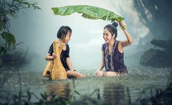 https://pixabay.com/photos/woman-young-rain-pond-cambodia-1807533/