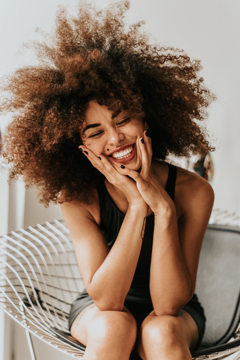 https://www.pexels.com/photo/woman-sitting-and-smiling-1858175/