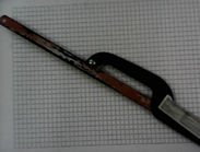 Ножовка по дереву с мелкими зубьями или по металлу с запасом полотен.