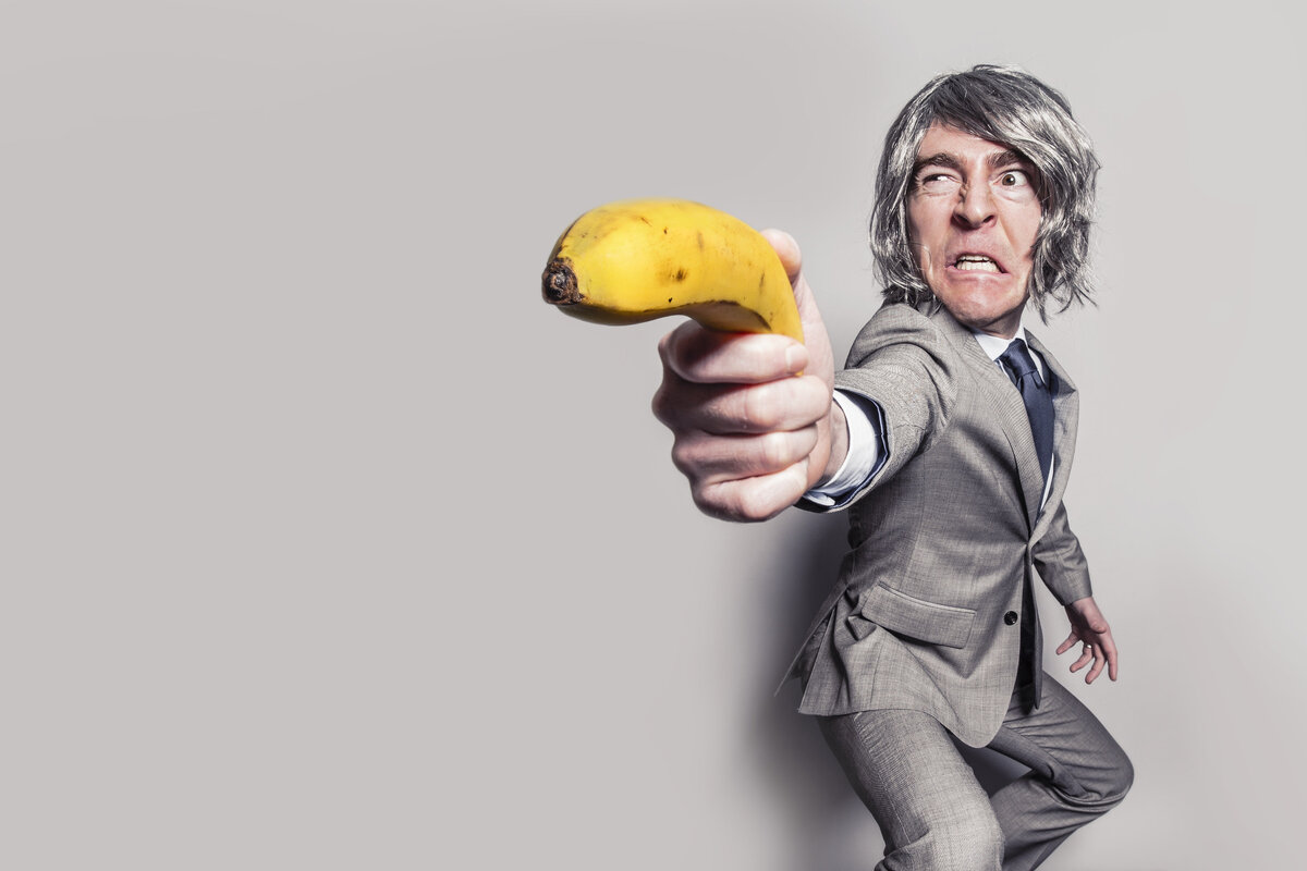https://www.pexels.com/photo/man-in-gray-suit-jacket-holding-yellow-banana-fruit-while-making-face-37547/