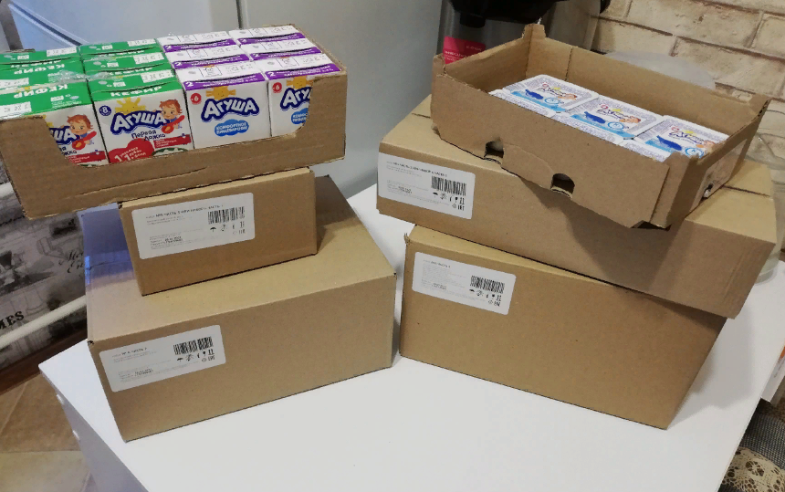 В коробках. Творога, кефира и кисломолочки - половина, через две недели предстоит съездить за второй партией.