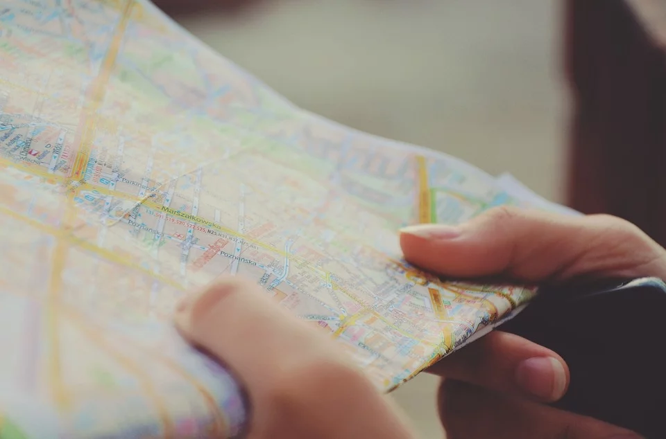 https://pixabay.com/photos/map-navigation-hands-travel-route-455769/