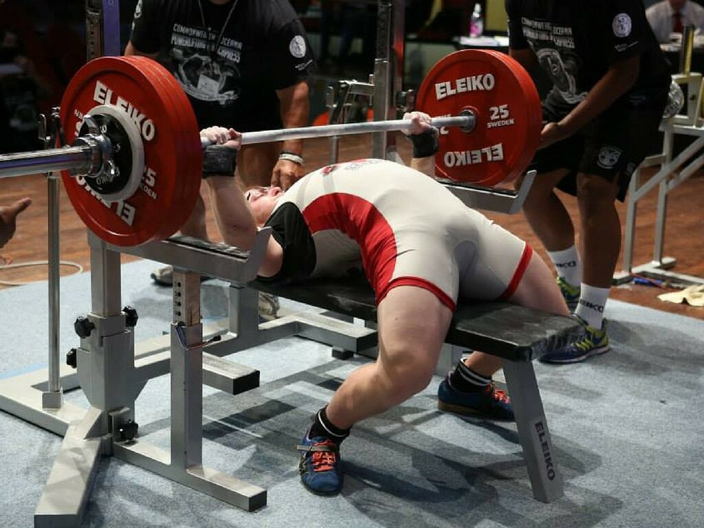 The Powerlifter Bench Presses