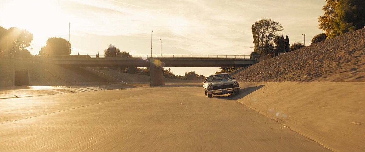 Wide shot. The paper Kites don't keep Driving