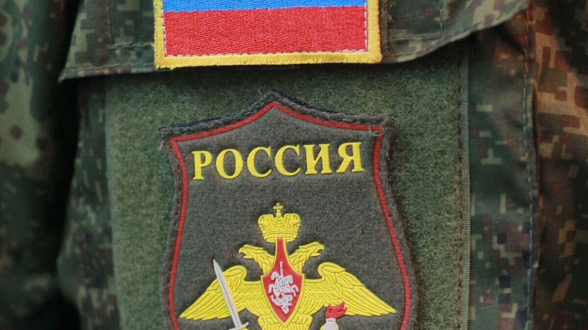   Шеврон на рукаве новой формы для военнослужащих российской армии© РИА Новости / Виталий Белоусов