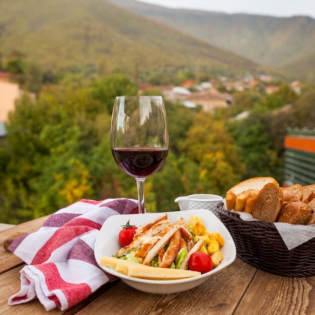 <a href="https://www.freepik.com/free-photo/delicious-meal-bowl-with-wine-bread-side-view-with-village-background_7753370.htm#query=%D0%B3%D1%80%D0%B5%D1%86%D0%B8%D1%8F%20%D0%B2%D0%B8%D0%BD%D0%BE&position=8&from_view=search&track=ais">Image by 8photo</a> on Freepik