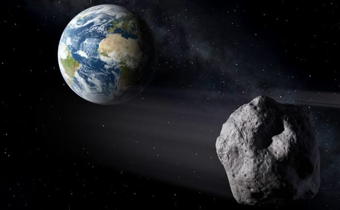 Крупный астероид пролетает мимо Земли (в представлении художника) © ESA