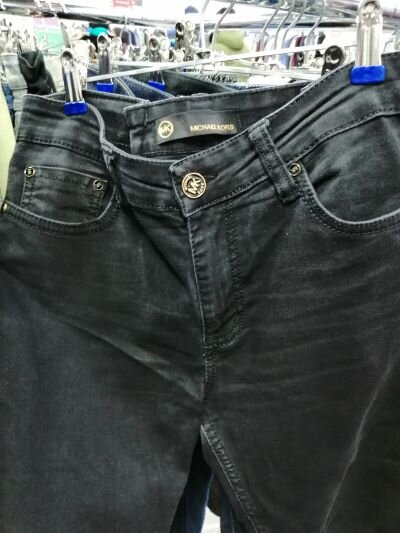 Бренд MICHAEL KORS (возможно).