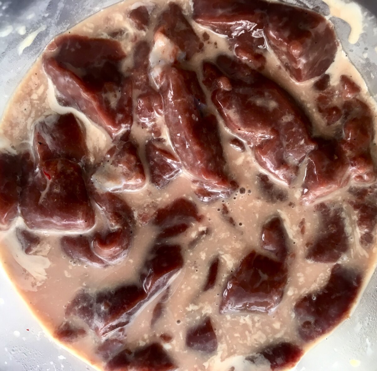 Посолить, поперчить , залить молоком на пол часа. 