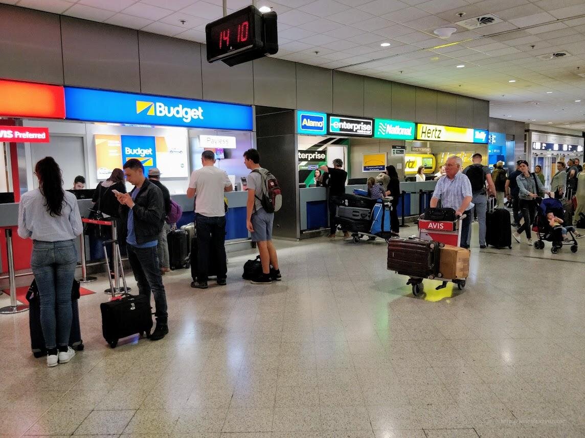 Мимо не пройдете, на первом этаже на выходе из здания аэропорта