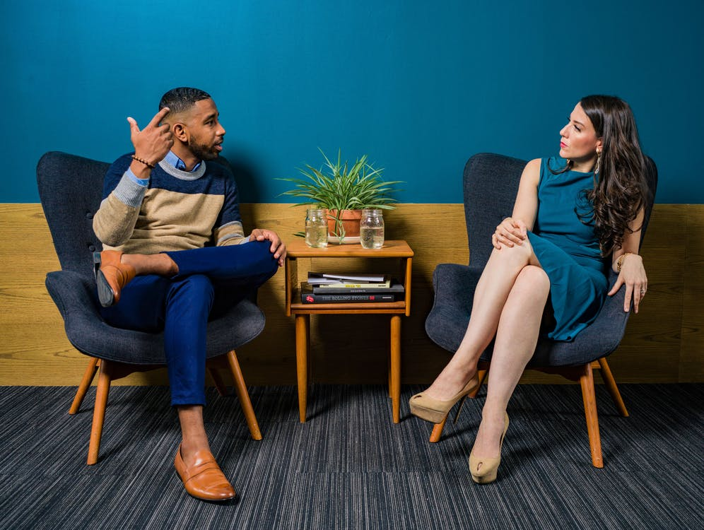  https://www.pexels.com/photo/woman-wearing-teal-dress-sitting-on-chair-talking-to-man-2422280/ 