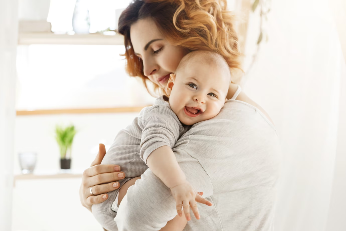 https://img.freepik.com/free-photo/happy-young-mom-holds-precious-little-child-and-gently-hugging-his-little-body-kid-laughing-joyfully-and-looking-at-camera-with-big-grey